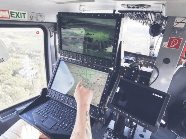 An operator in a helicopter using the AIMS-ISR software