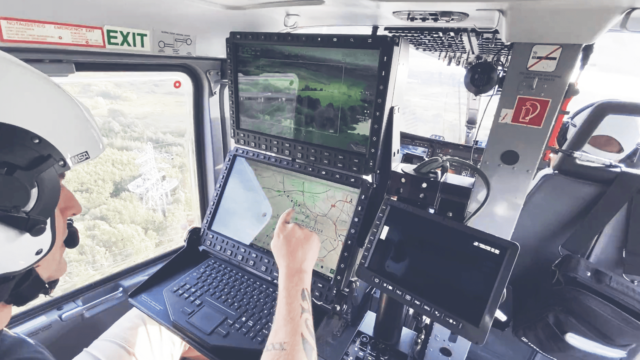 An operator in a helicopter using the AIMS-ISR software